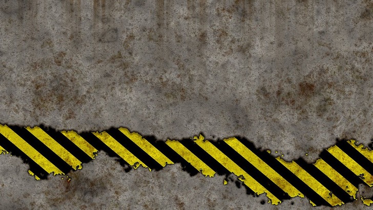 Warnzeichen vor Betonwand